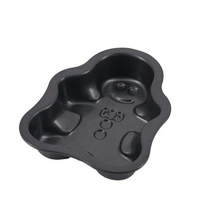 One De Buyer non-stick steel mini gingerbread man moulds, showing the inside on a white background