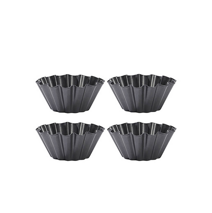 Four De Buyer Brioche Mounds showing fluted edges on a white background