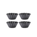 Four De Buyer Brioche Mounds showing fluted edges on a white background
