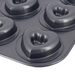 De Buyer six-cup non-stick steel cake tray, close up of one of the heart shaped moulds on a white background