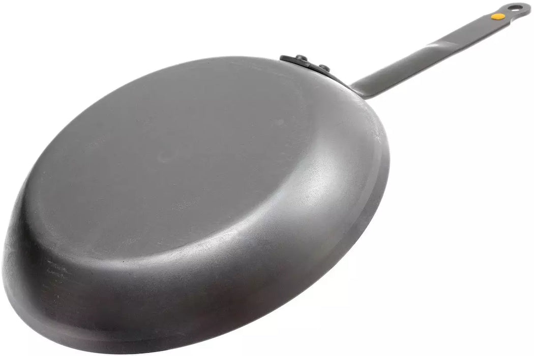 A dark gray De Buyer Mineral B frying pan with a long handle, shown from an elevated angle on a plain white background.
