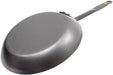A dark gray De Buyer Mineral B frying pan with a long handle, shown from an elevated angle on a plain white background.