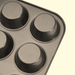 Close-up of the non-stick muffin tray with four visible cup compartments, on a white background.