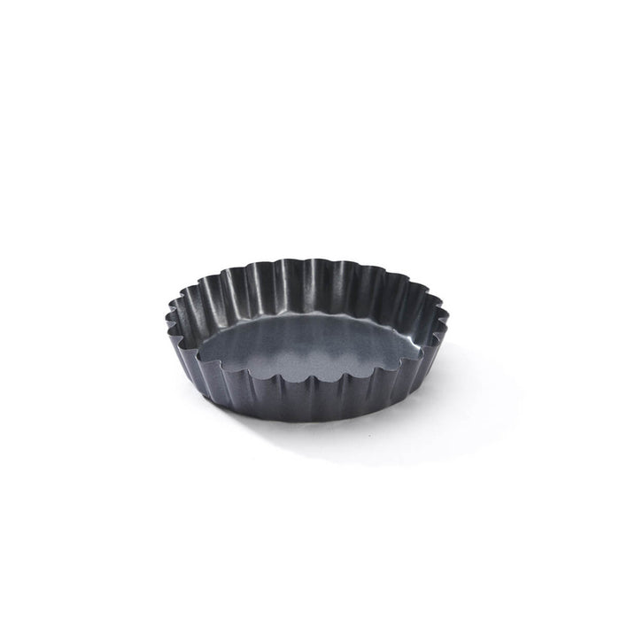 De Buyer round fluted tartlet mould showing its non-stick coated steel finish