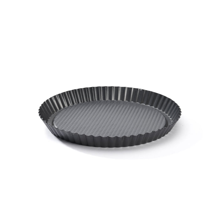 A dark gray fluted tart pan with a textured non-stick interior, shown on a clean white background.