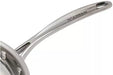 Close-up of a stainless steel saucepan handle with the SCANPAN brand name engraved on a clean white background.