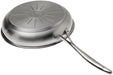 A stainless steel SCANPAN Impact frying pan shown from a high-angle perspective, displaying its brushed metal exterior, textured sunburst pattern on the bottom, and a long, polished handle on a solid white background.