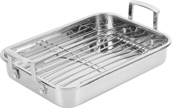 Stainless steel roasting pan with rack on a white background