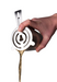 A hand holding a cocktail shaker using a Vacu Vin stainless steel cocktail strainer, pouring a golden drink, on a white background.
