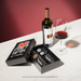Vacu Vin x Keith Haring Wine Open & Save Set shown with wine bottle and accessories