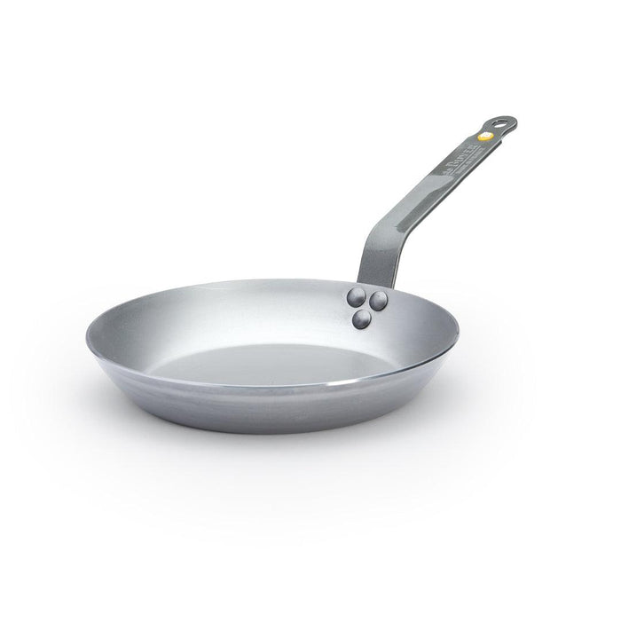 A De Buyer Mineral B carbon steel frying pan with a natural non-stick finish and a steel riveted handle.
