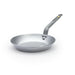 A De Buyer Mineral B carbon steel frying pan with a natural non-stick finish and a steel riveted handle.
