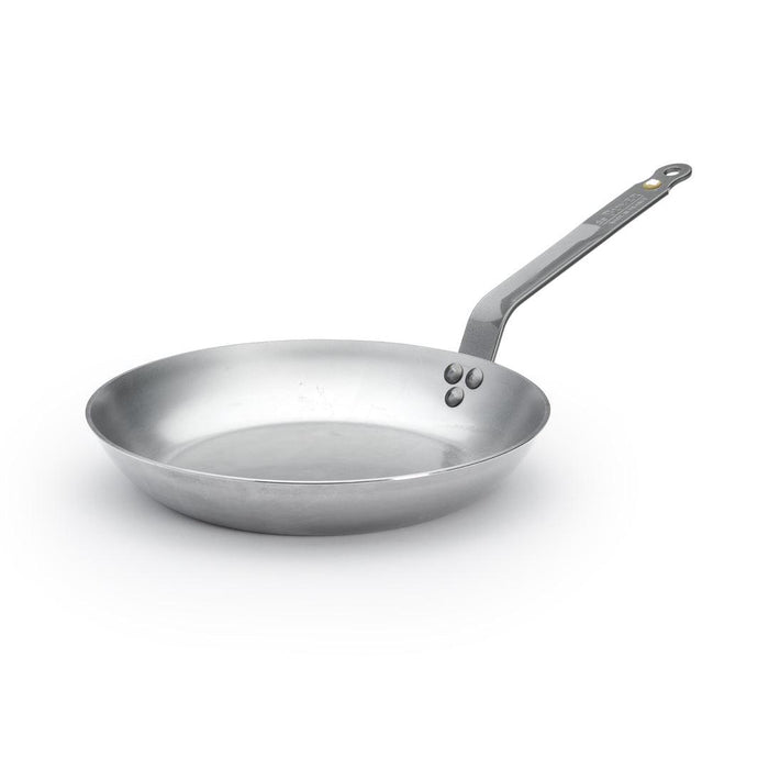 A silver De Buyer Mineral B carbon steel frying pan with a single handle.