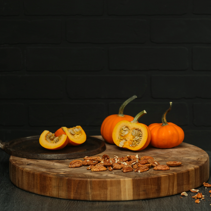 TeakHaus Butcher Block Round Serving & Cutting Board in use