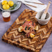 TeakHaus Herringbone Chopping Board Large in use